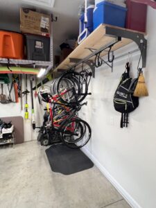 Wall mount with shelf and large sliding hooks.