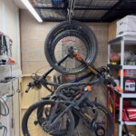 Bikes hanging under spider rack on a variety of GearBlocks swiveling hooks.